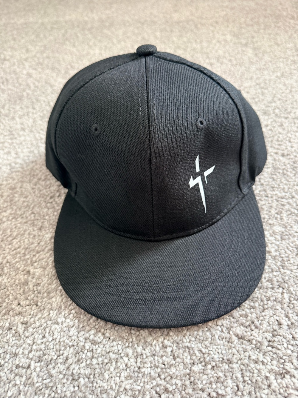 Black Snapback Baseball Cap with White Cross Logo – Adjustable